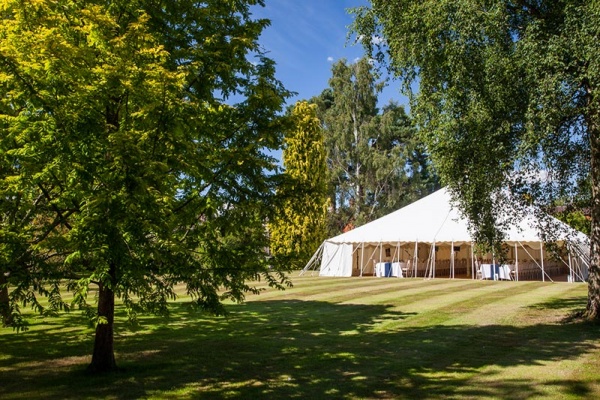 Open sided wedding marquee in summer | Lewis Marquees